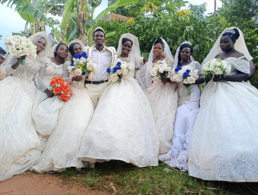 Hajj Habibu Ssalongo Nsikonnene poses for a photo with his 7 wives on September 10, 2023, before taking them around Mukono District. PHOTO/FRED MUZAALE