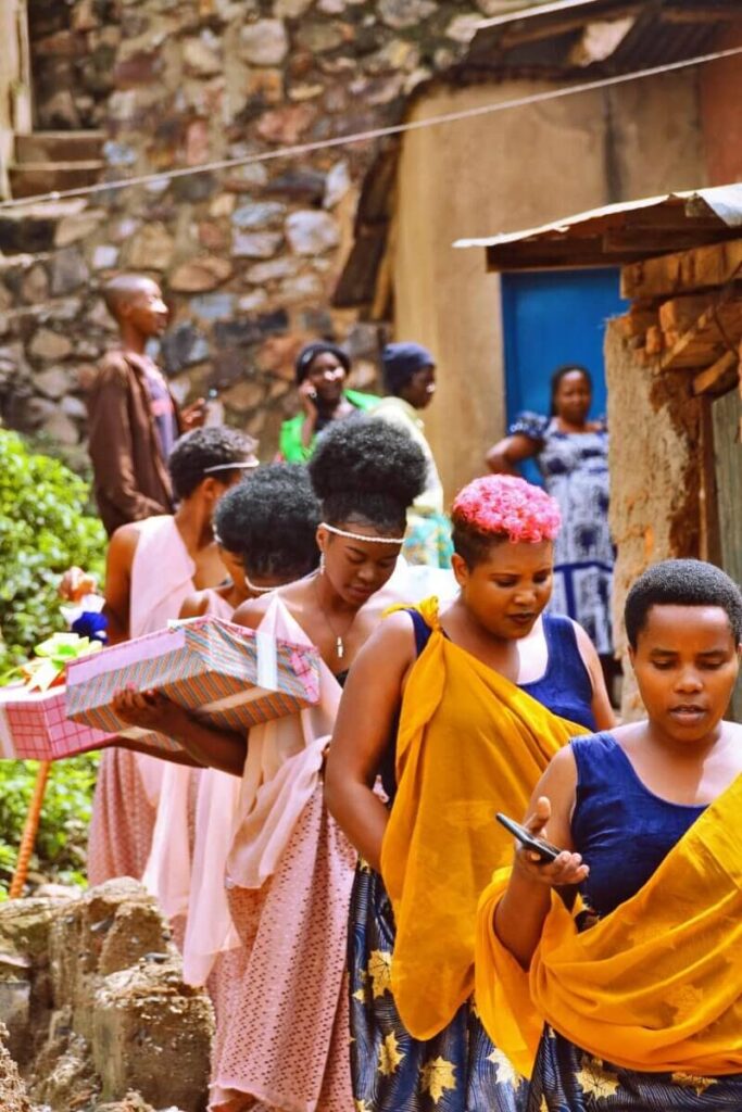 Beautiful Ugandan women on their bridesmaid duties. Image Source: volunteerabroadcooperating