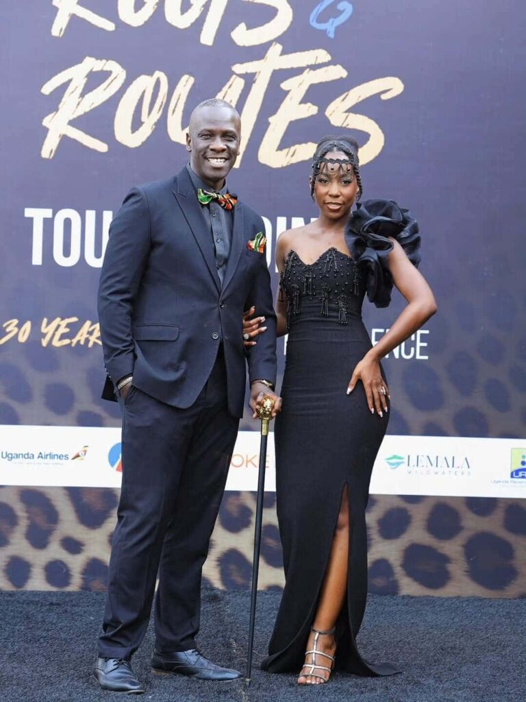 Ugandan wedding and event MCs Dr. Ronnie Mich Egwang and Malaika Tenshi serving as hosts for the Association of Uganda Tour Operators' 30 Years of Excellence Roots and Routes Tour Dinner. Image Source: Instagram/@malaikatenshi