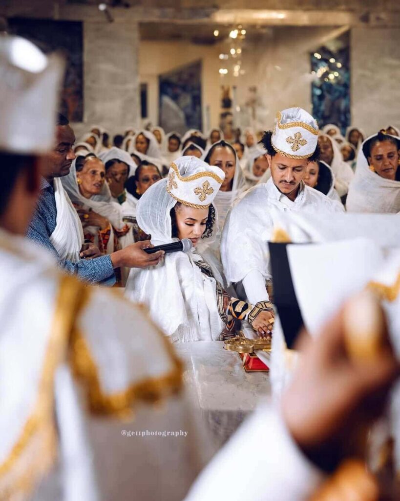 Ethiopian & Eritrean Orthodox couple photographed by Getnet Teshome. Image Source: Instagram/@gettphotography