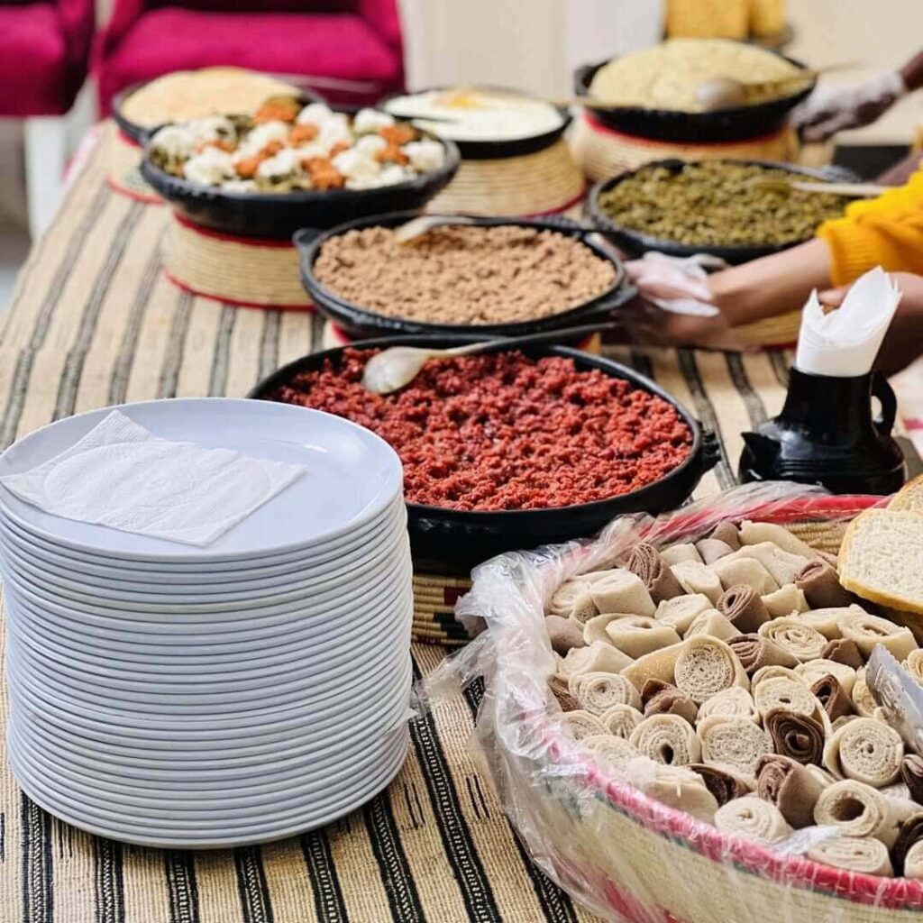 A traditional, delicious Gurage food at a wedding. Image Source: Instagram/@abet_kitfo_catering
