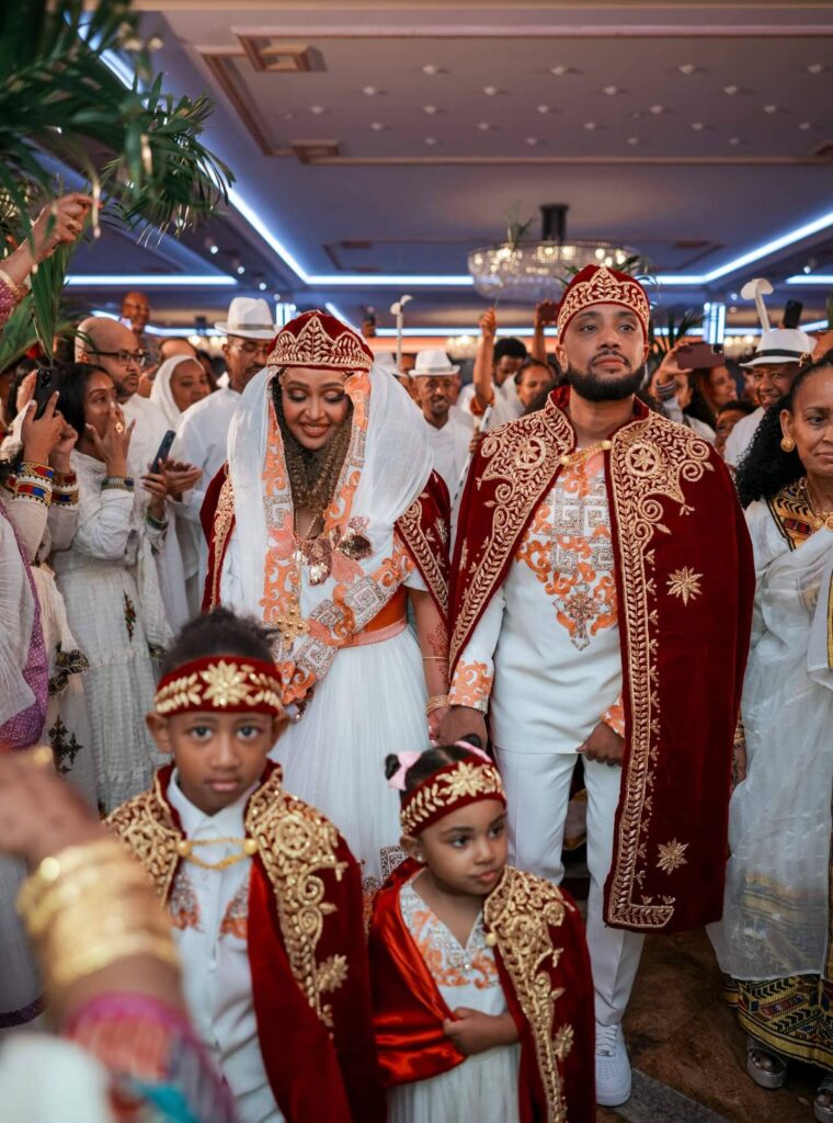 An Ethiopian Orthodox Church wedding with the bride and groom in Habesha-made custom dresses. Image Source: Instagram/@gettphotography