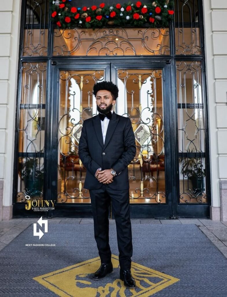Henok Sisay, the CEO and creative director of Makeup by Heni Afro. Image Source: Instagram/@makeupby_heni_afro